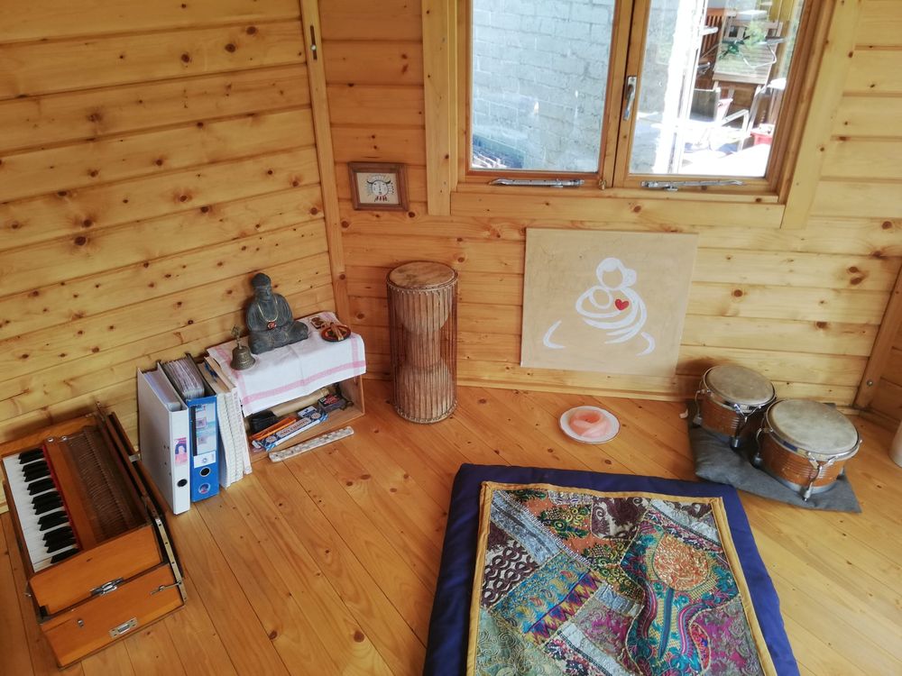 Harmonium, Buddha statue and drums in a corner of the pavilion